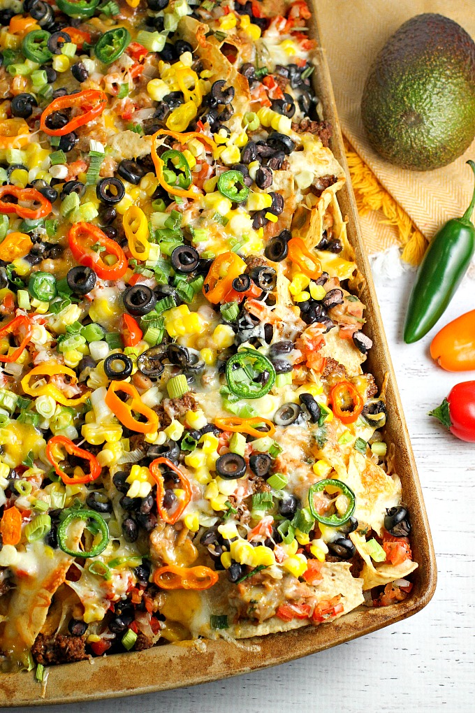 These Homemade Nachos, loaded with your favorite healthy fixings, are perfect for game day!