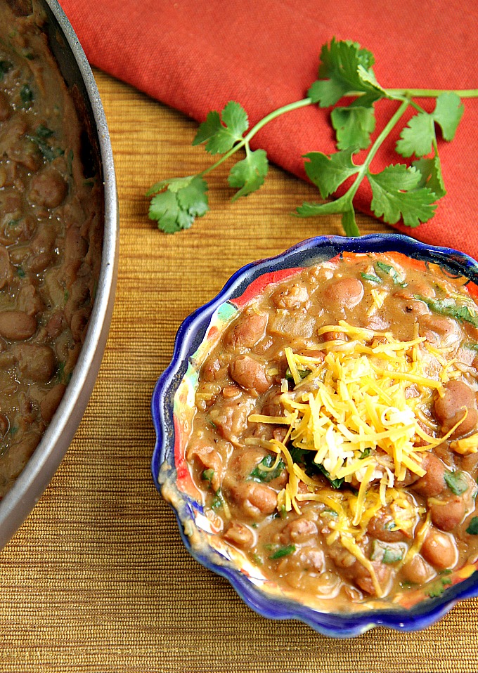 You'll never eat refried beans from a can again after trying this easy homemade refried beans recipe! They only take 15 minutes to make, and they're so versatile...use them as a side dish, as a base for burritos, or in layered bean dip or loaded nachos as well!