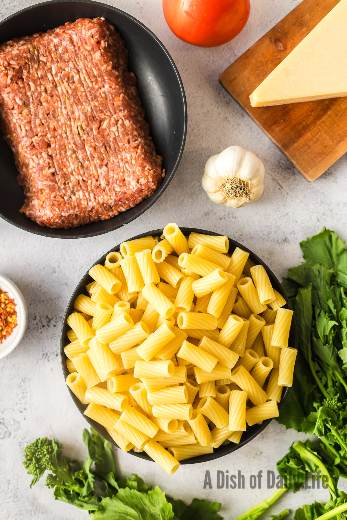 All ingredients for Rigatoni Salsiccia laid out on counter