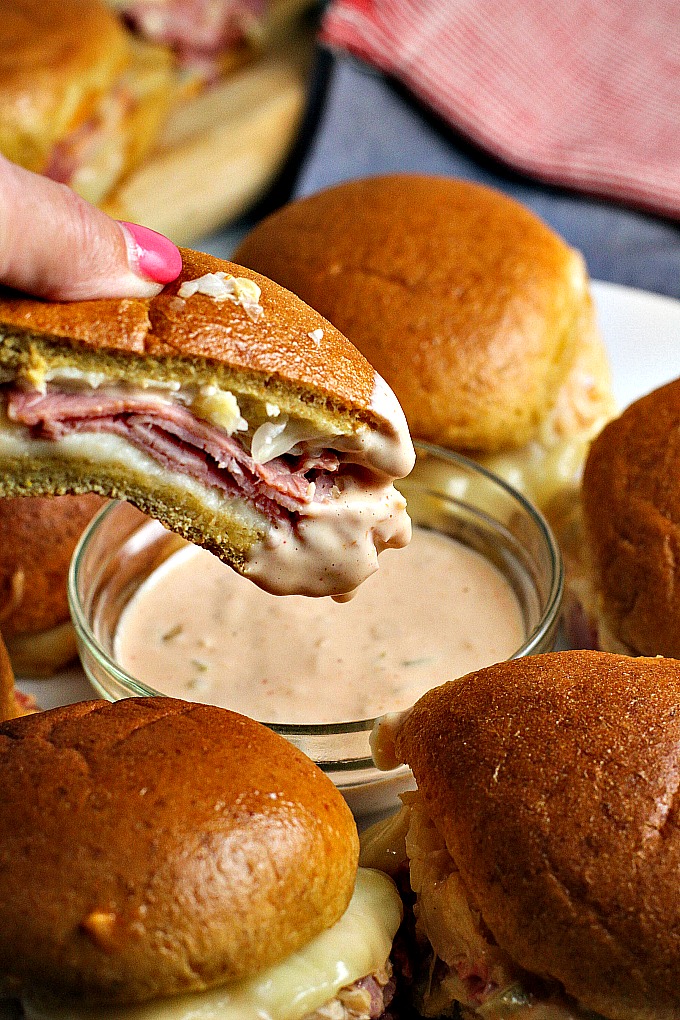 Get ready for game day with these Reuben Sliders with Homemade Russian Dressing...they're an easy to make appetizer recipe that everyone will love!