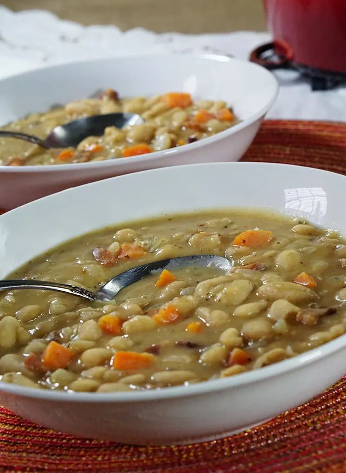 Love bean soup but don't have a day to make it? No problem! This delicious Bean Soup with Bacon recipe has all the slow cooked flavor you love, but can be made quickly using pantry ingredients for an easy comfort food weeknight meal the whole family will love!