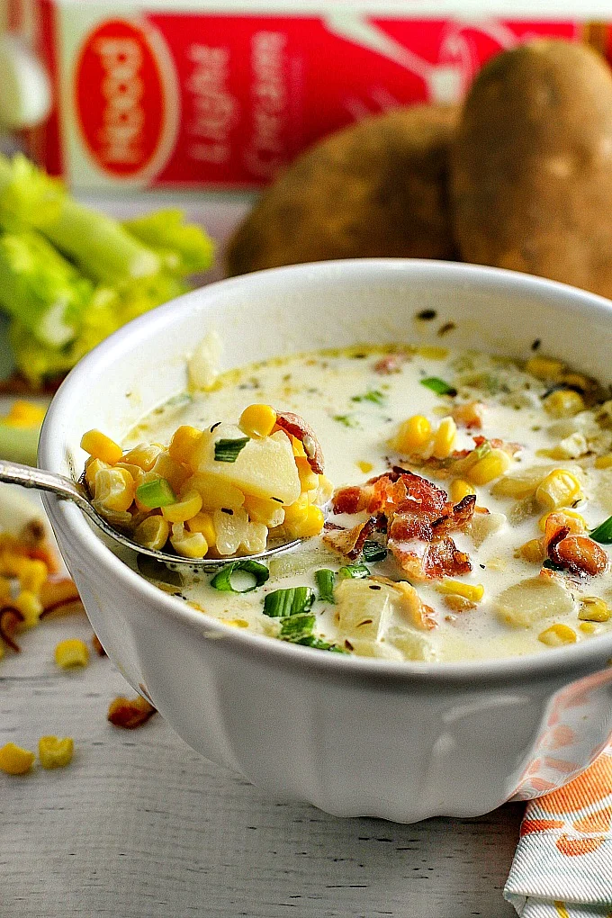 This easy (and delicious!) Corn Chowder is packed with sweet corn and potatoes, and topped with bacon and chopped green onions. A family favorite, it's hearty enough for a weeknight supper paired with a light salad, versatile enough for game day, and you can even use it as a holiday starter!