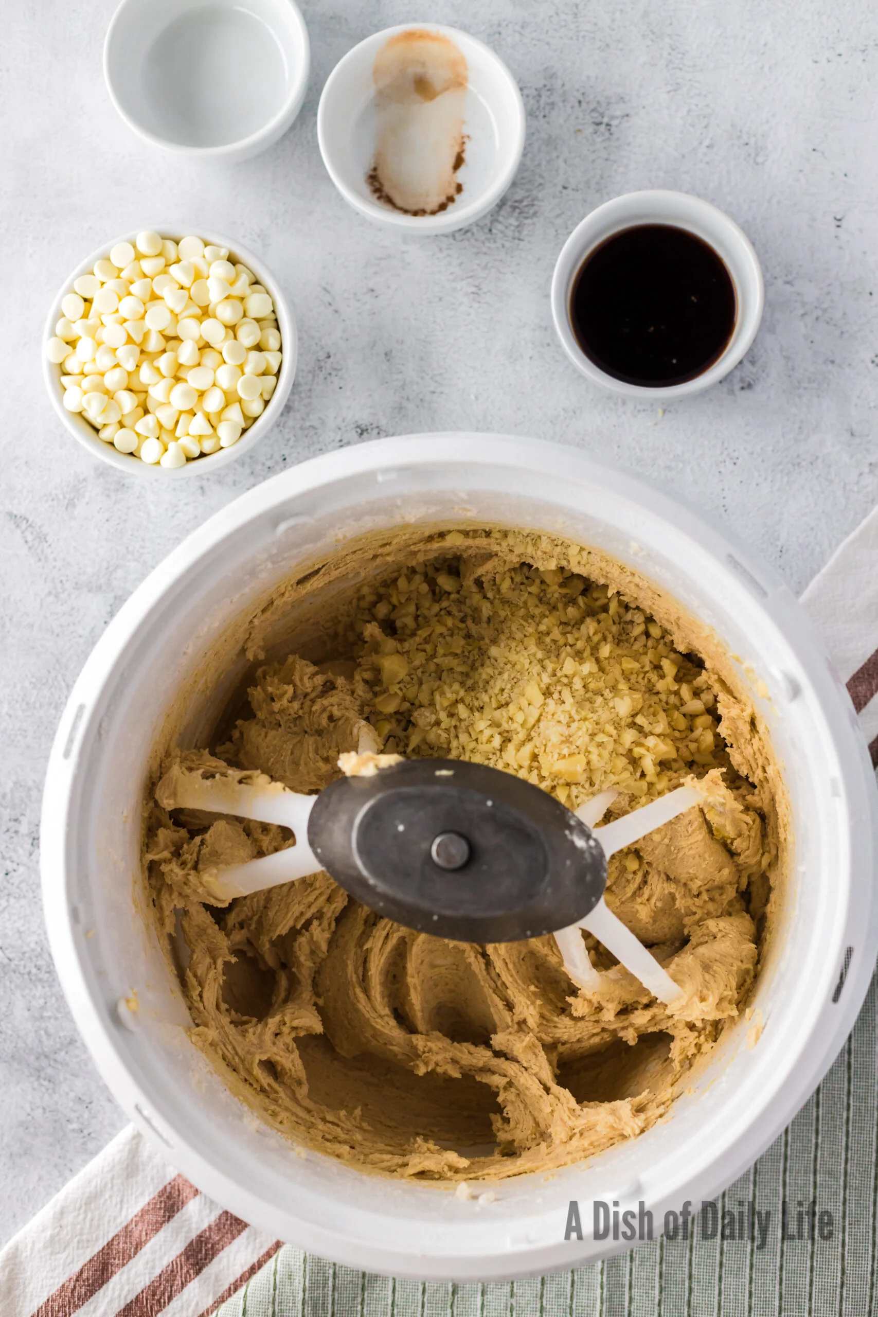chopped macadamia nuts added to mixing bowl.