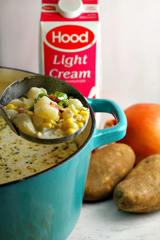 This easy (and delicious!) Corn Chowder is packed with sweet corn and potatoes, and topped with bacon and chopped green onions. A family favorite, it's hearty enough for a weeknight supper paired with a light salad, versatile enough for game day, and you can even use it as a holiday starter!