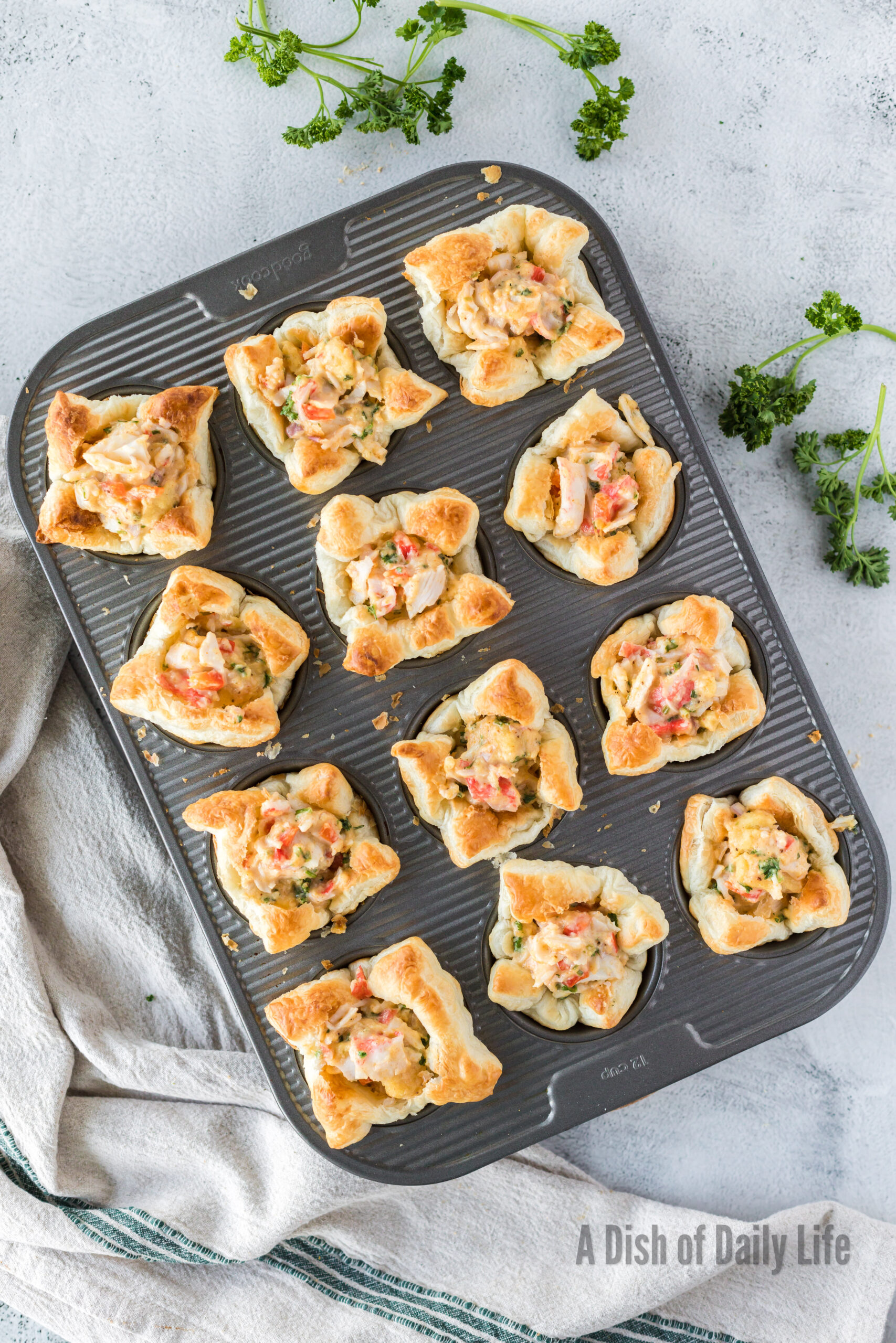 baked crab imperial appetizer still in the muffin tin