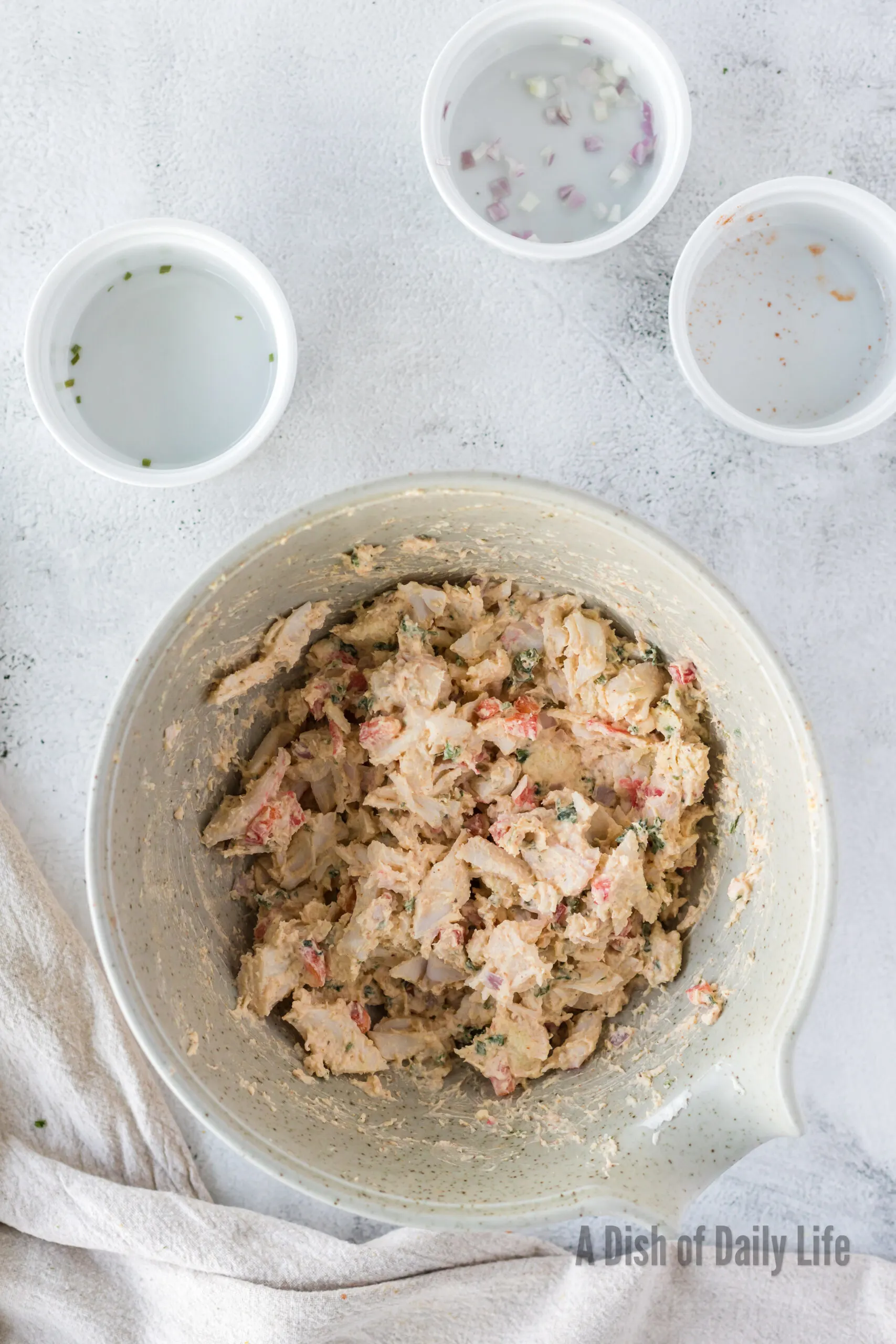 all ingredients for crab imperial appetizer except for puff pastry in bowl and mixed together