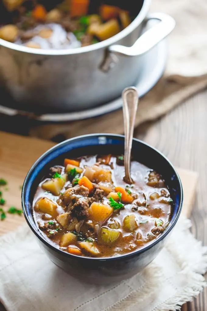 Quick Beef Stew...this stove-top version features lean ground beef, is naturally gluten free, full of rich flavor and only takes 45 minutes to make! It's a comfort food dish the whole family will love!