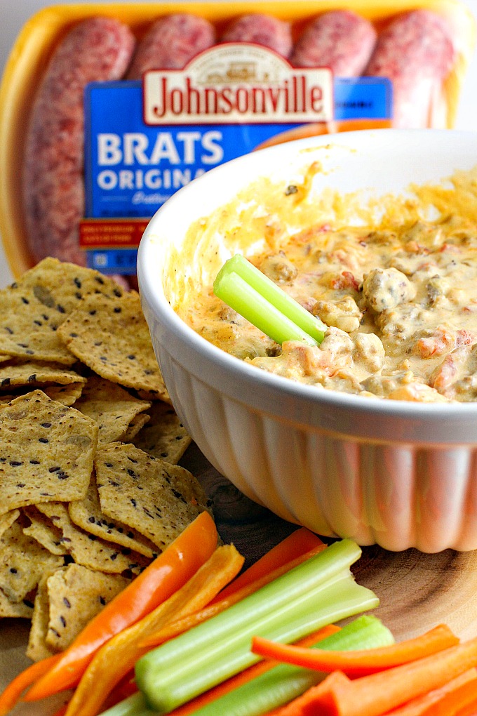 This Crock Pot Sausage Cheese Dip is an easy-to-make crowd pleaser for game day! Only minutes of prep work, then throw all your ingredients in the slow cooker for an hour. Great with chips and veggies!