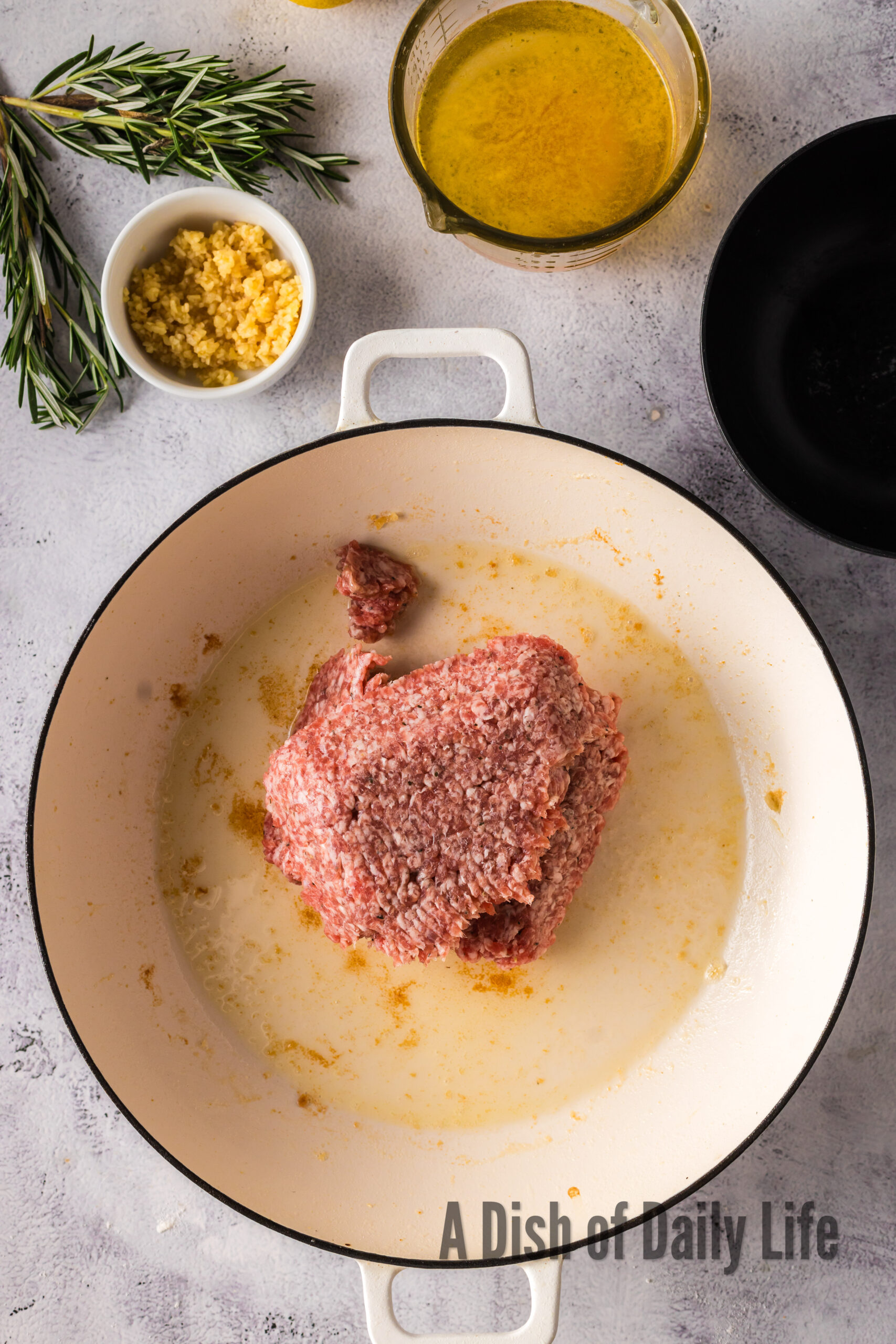 Sausage cooking in dutch oven.