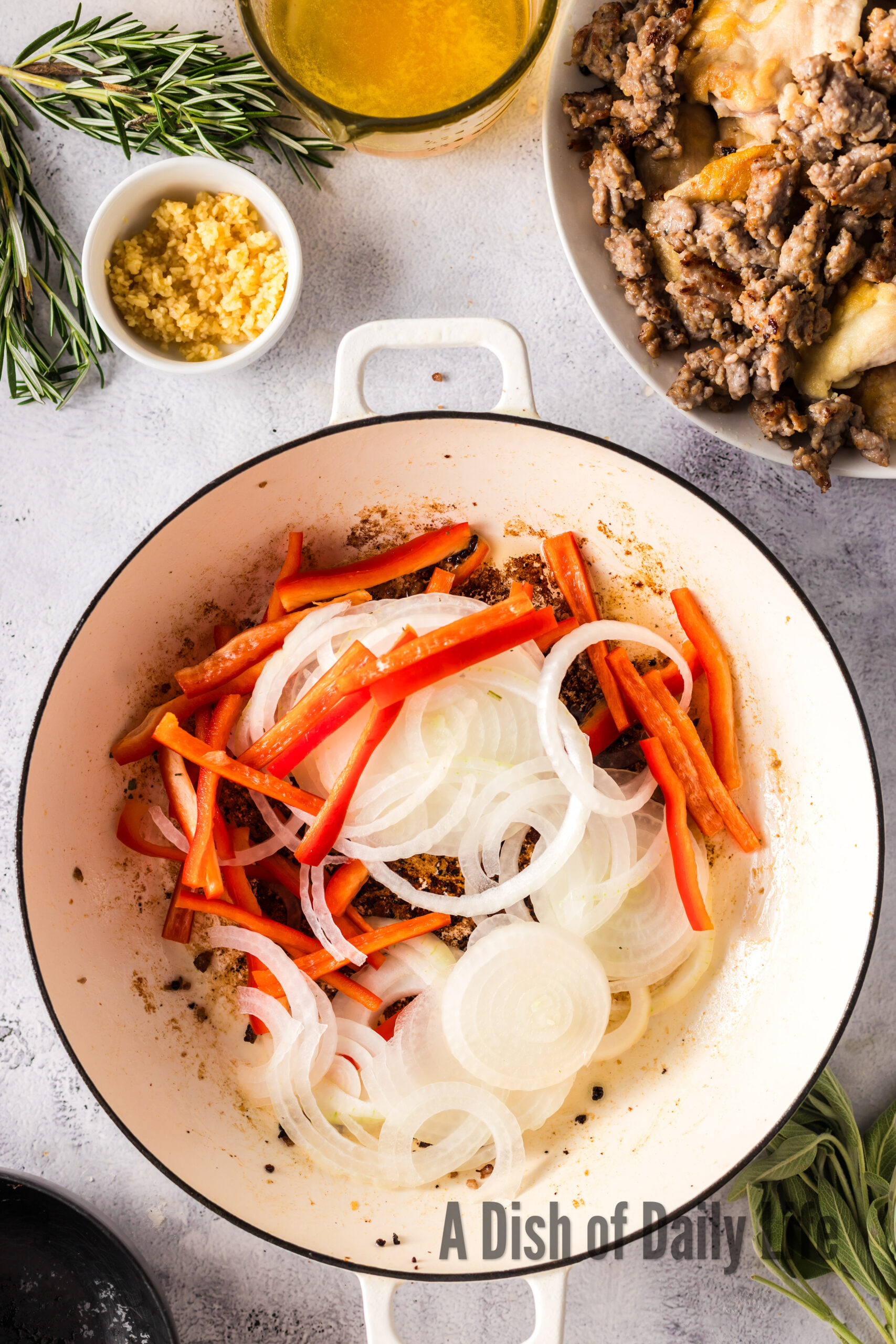 Onions and Bell Peppers in dutch oven ready to cook.