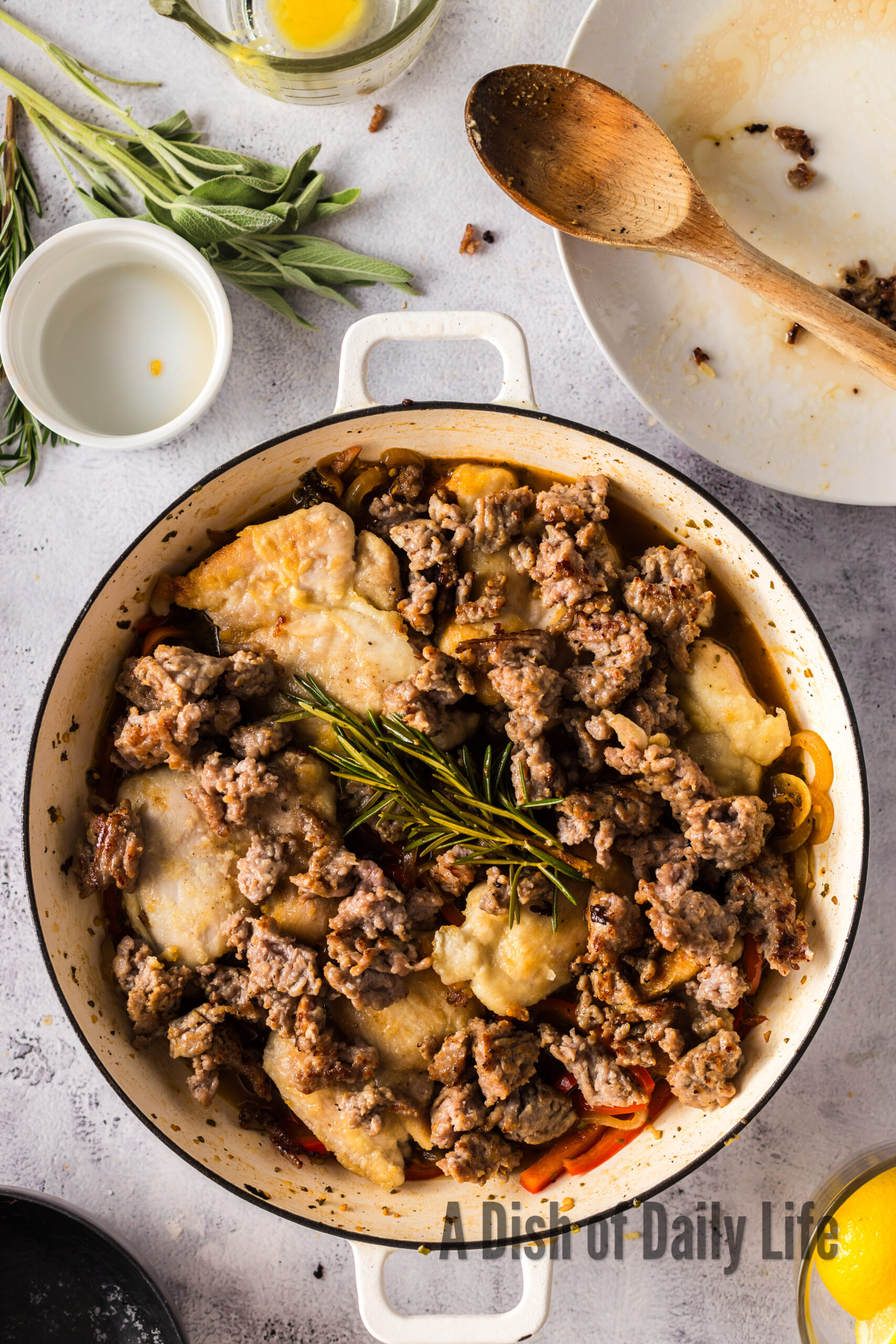 Peppadews, and wine added to chicken and sausage mixture