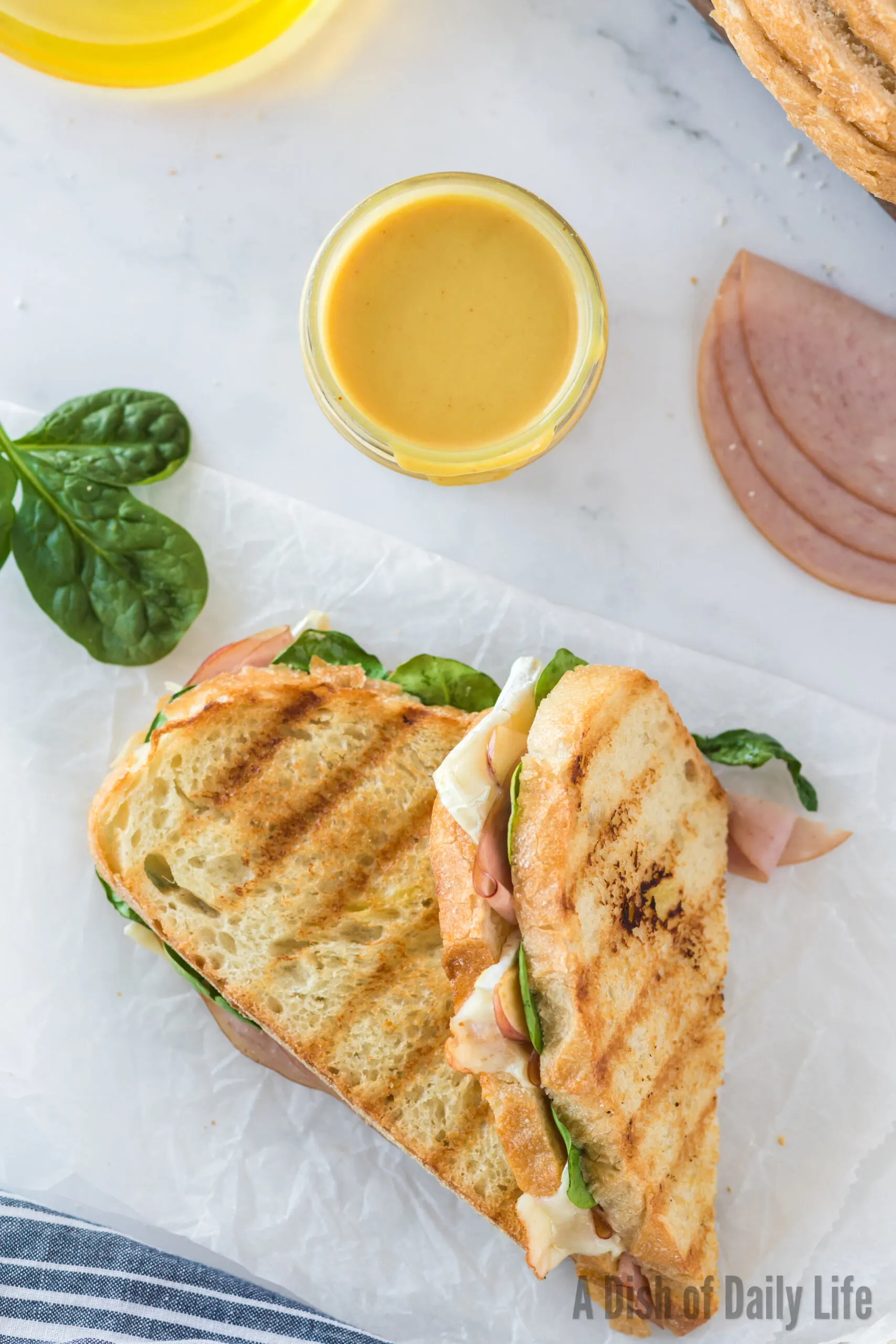 top view looking at a grilled panini sandwich cut in half