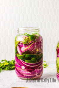 Pickled Onions in a jar, but not ready to eat.