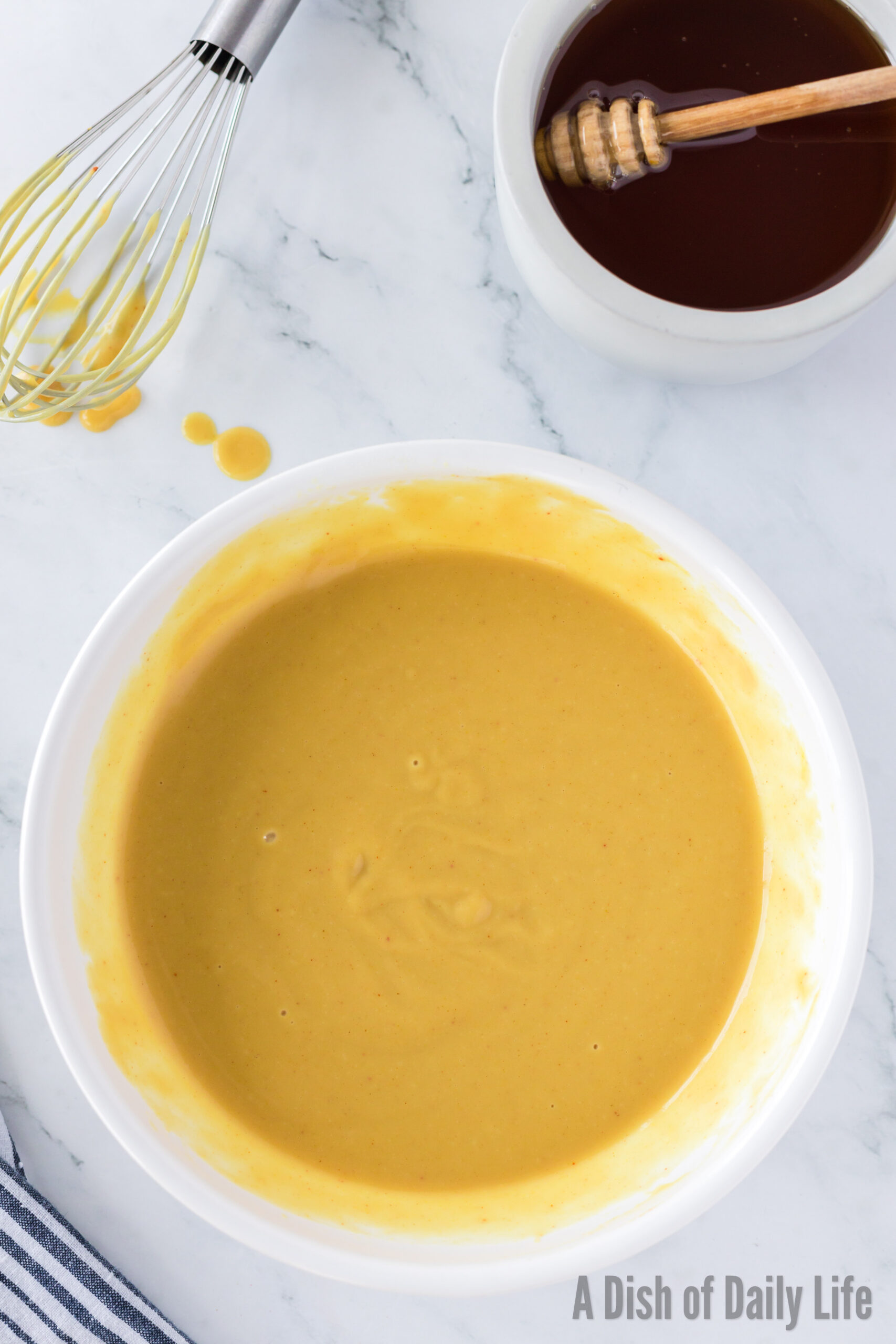 All ingredients mixed in bowl for honey mustard dressing