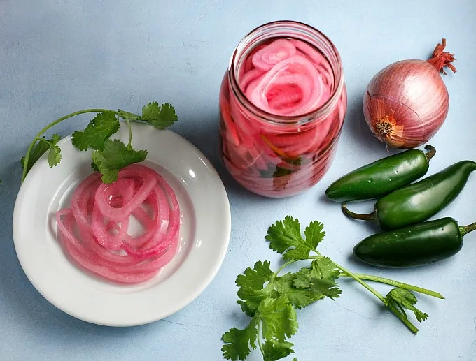 Spicy Pickled Red Onions are quick, easy, and the perfect accompaniment to sandwiches and salads, or tacos and burrito bowls!