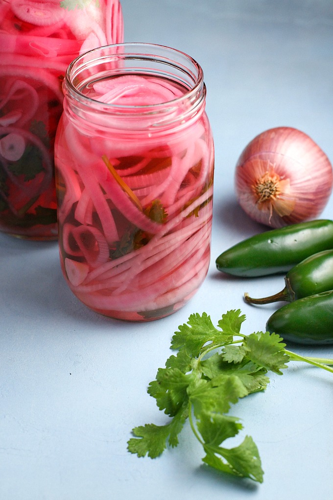 Spicy Pickled Red Onions are quick, easy, and the perfect accompaniment to sandwiches and salads, or tacos and burrito bowls!