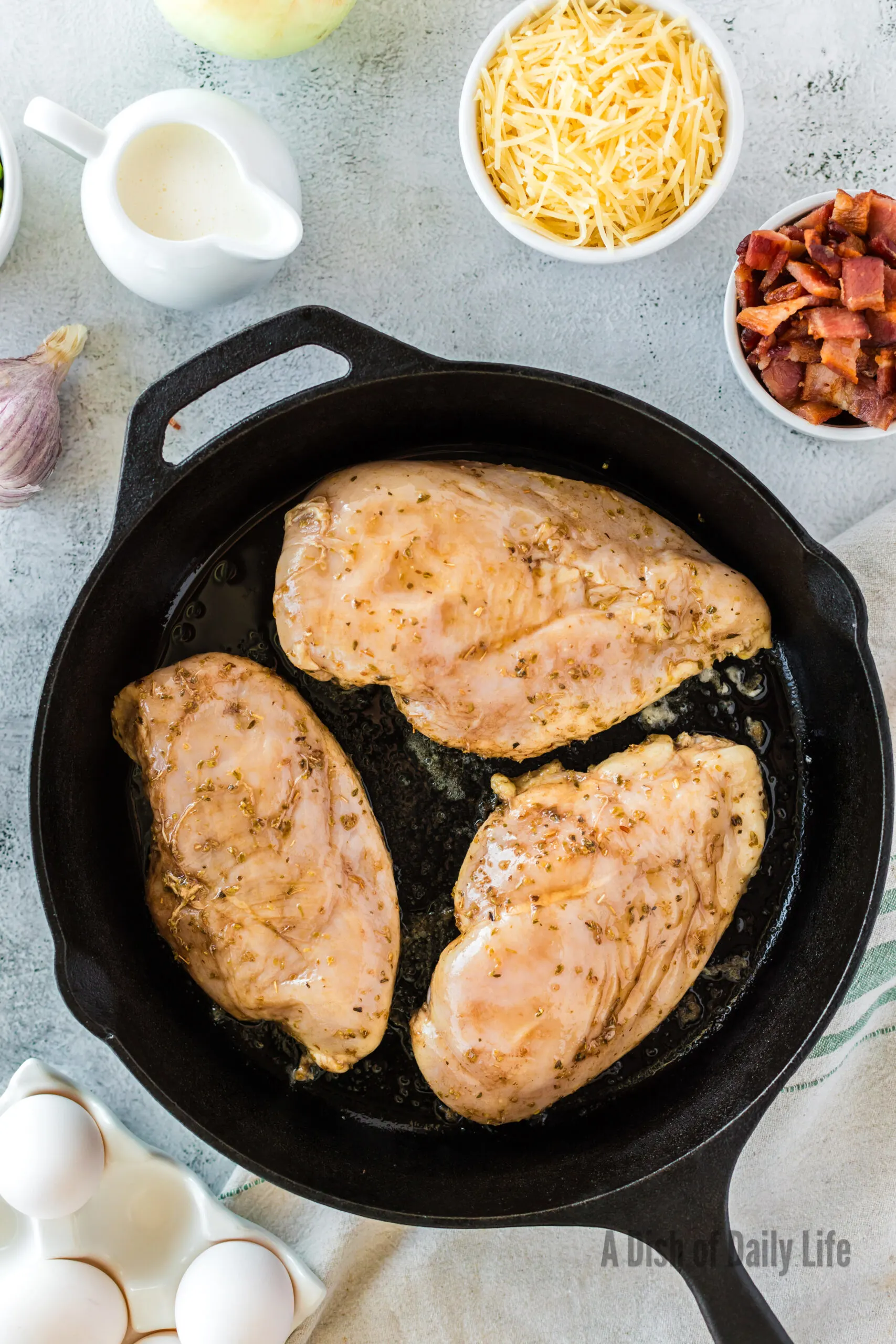 marinated chicken in skillet ready to cook