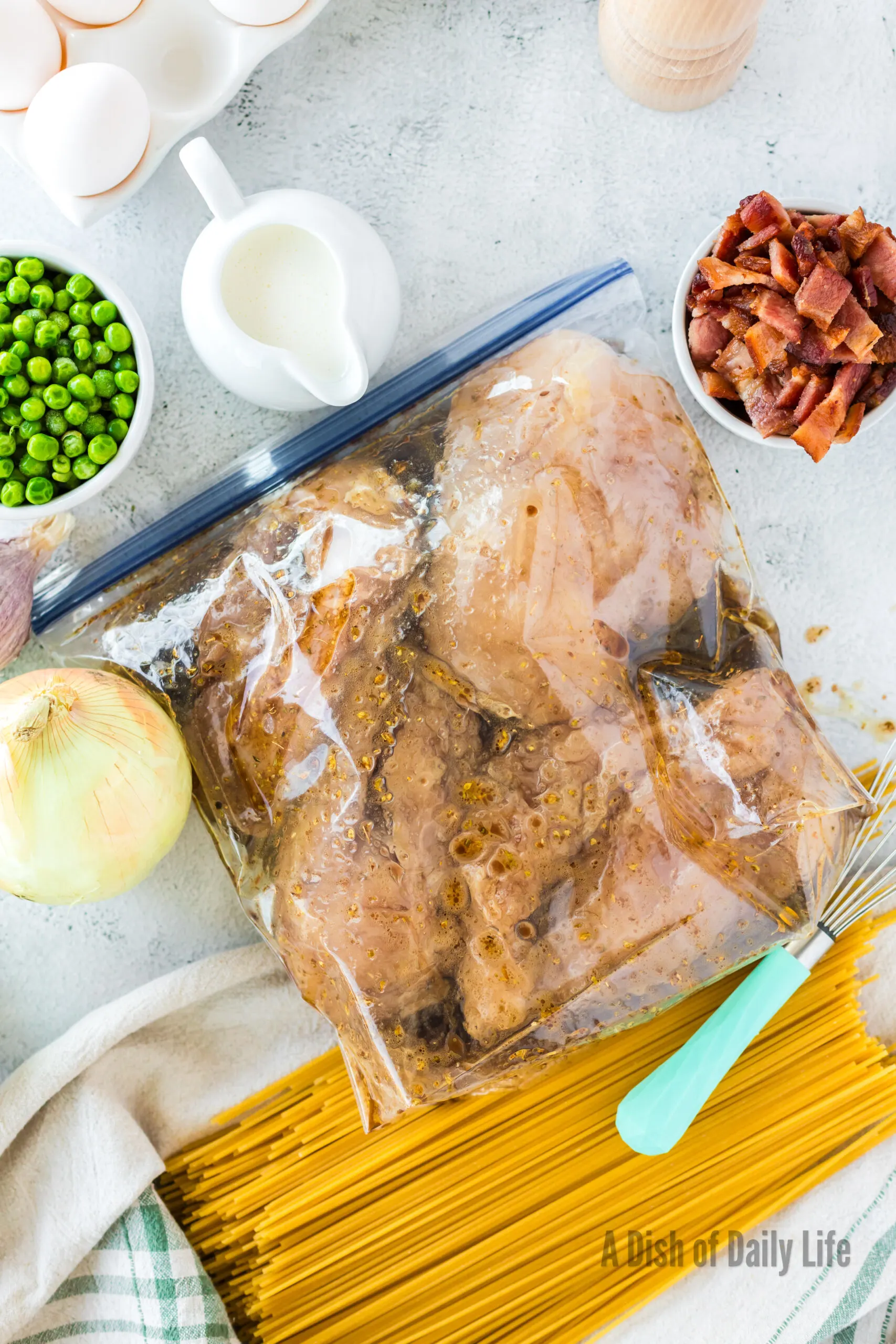 Chicken sitting in marinade.