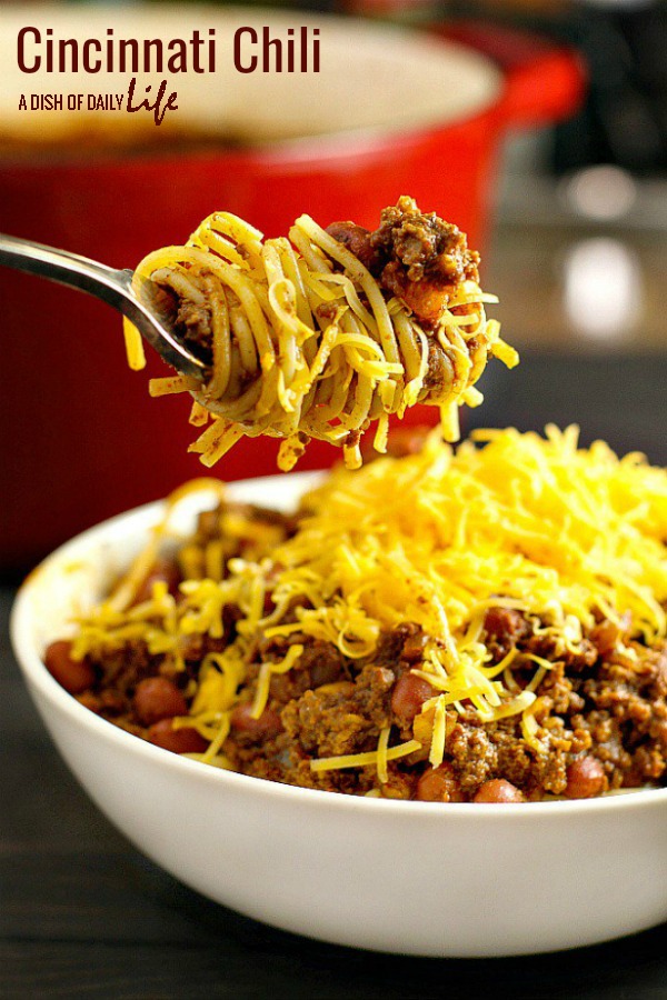 Inspired by the famous version, this Cincinnati Chili is a delicious ground beef chili with a unique spice mix, served over spaghetti and topped with cheese. Big family fave! #cincinnatichili #chili #comfortfood #groundbeef