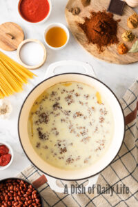 chilled beef and broth in pot.
