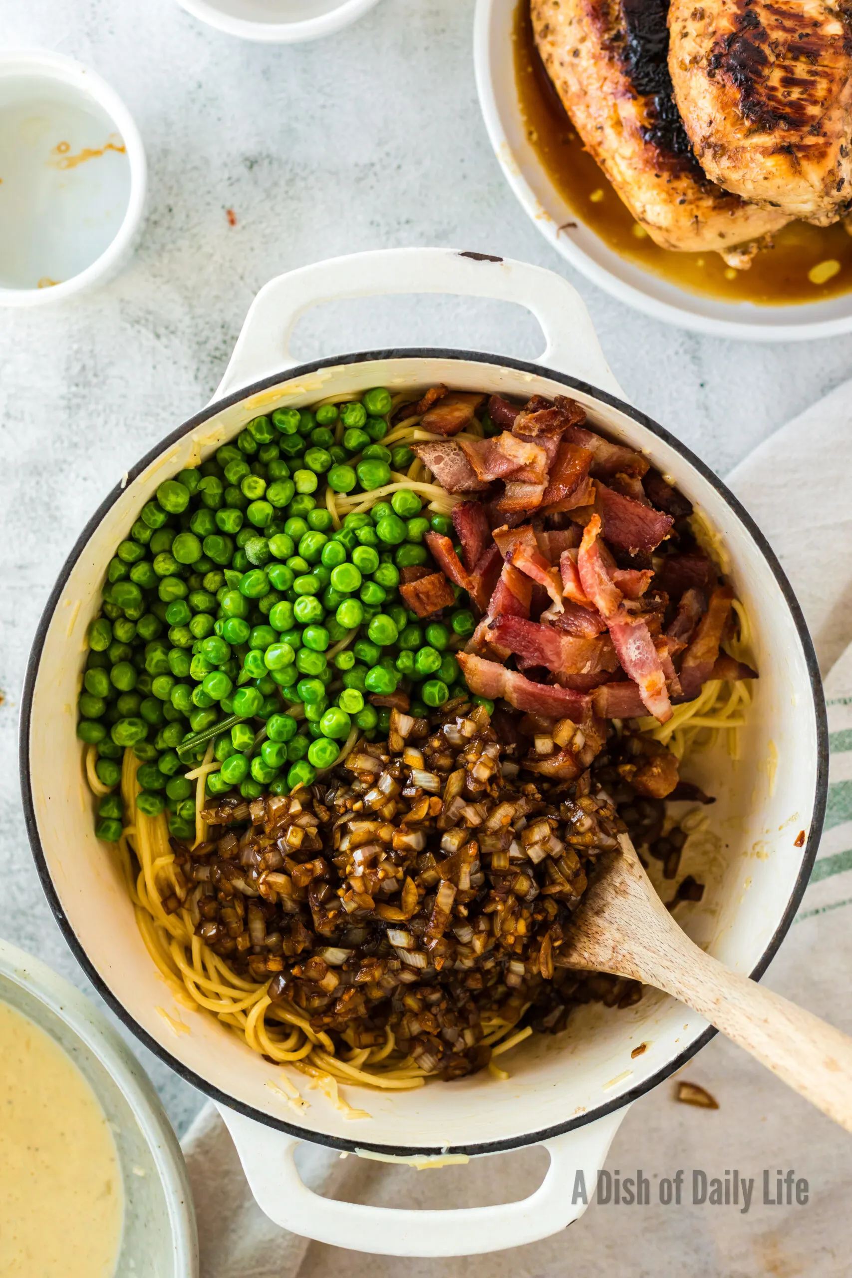 frozen peas, bacon, onion and garlic added to creamy pasta