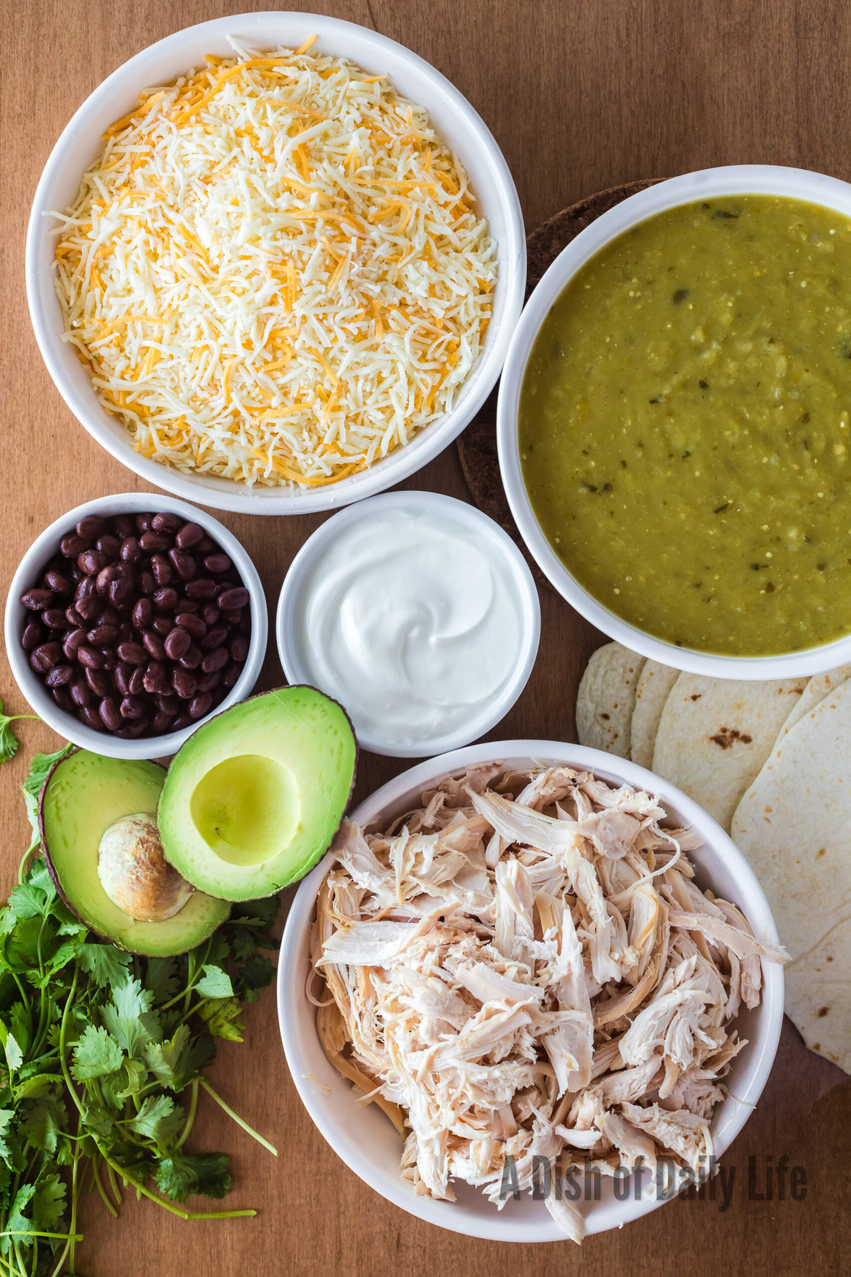 All ingredients for Chicken Enchiladas laid out on counter