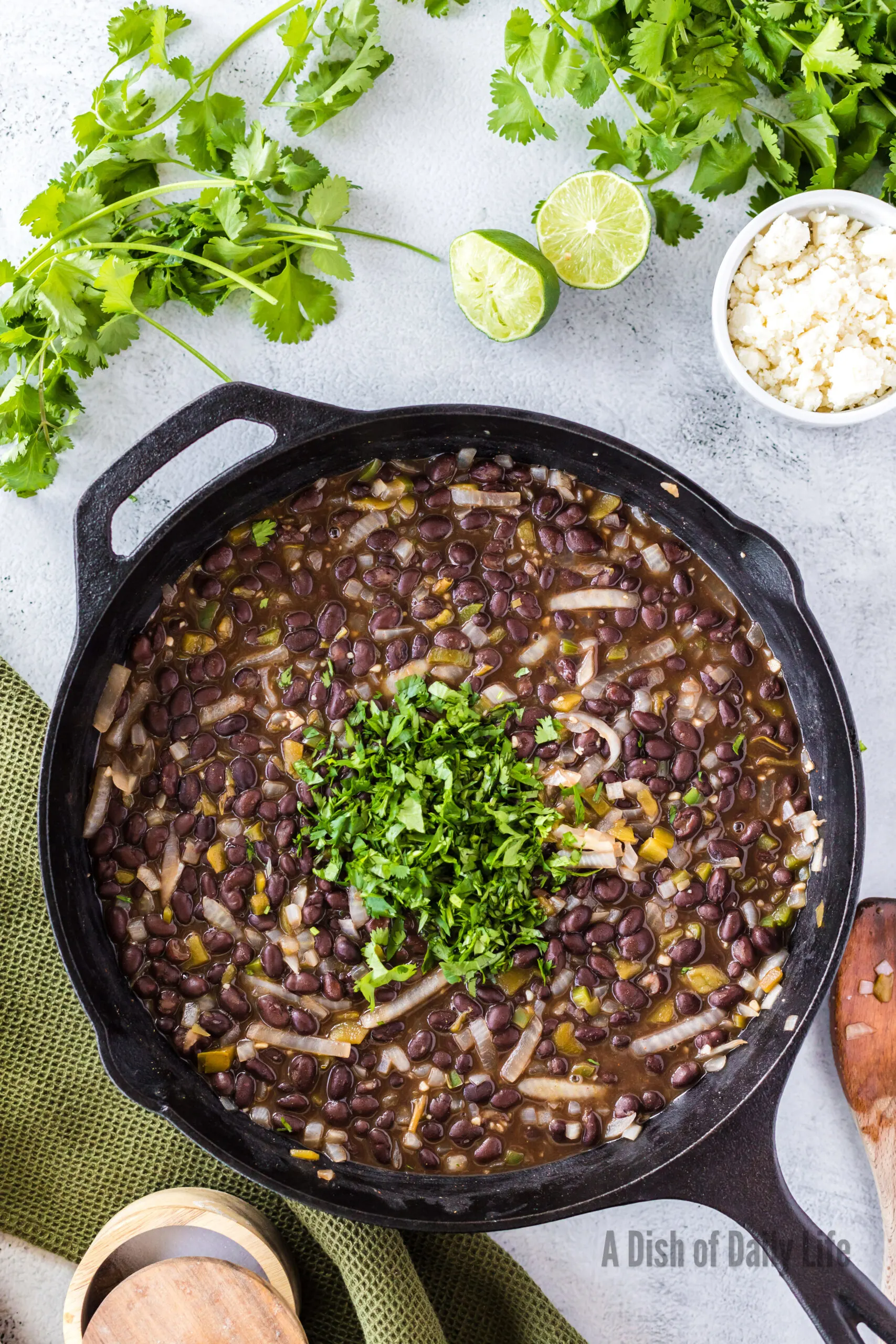 Cilantro and lime juice added to black bean mixture.