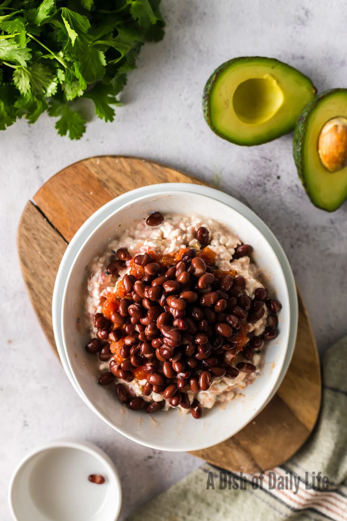 Black beans added on top of salsa and cottage cheese