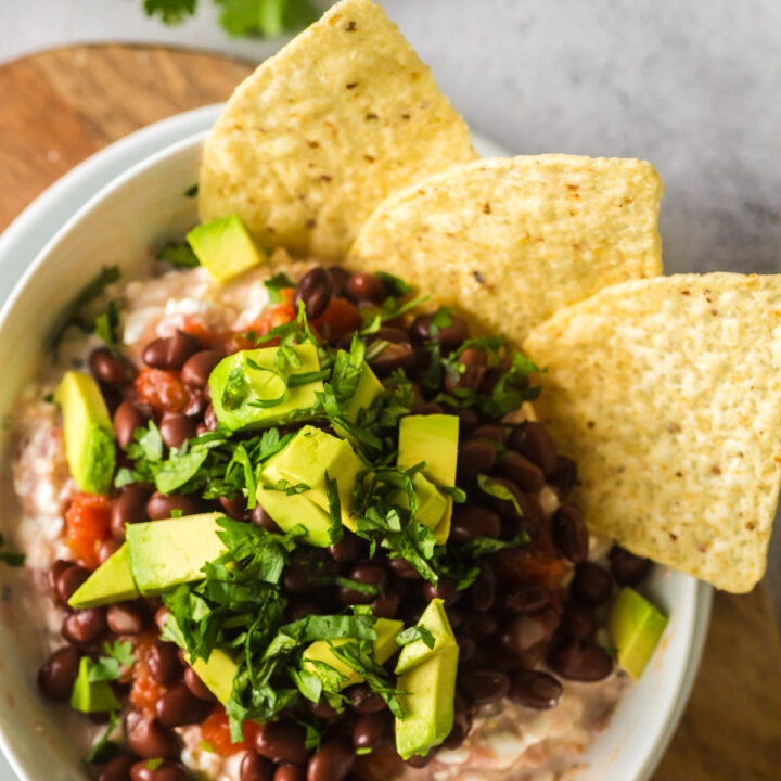 3 tortilla chips stuck into salsa mix to show it's a chip dip