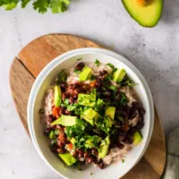 cilantro added on top of all other ingredients in a bowl