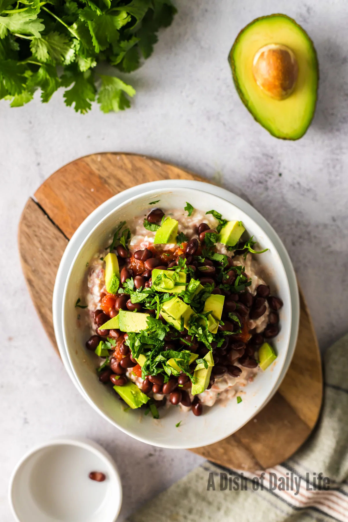 cilantro added on top of all other ingredients in a bowl