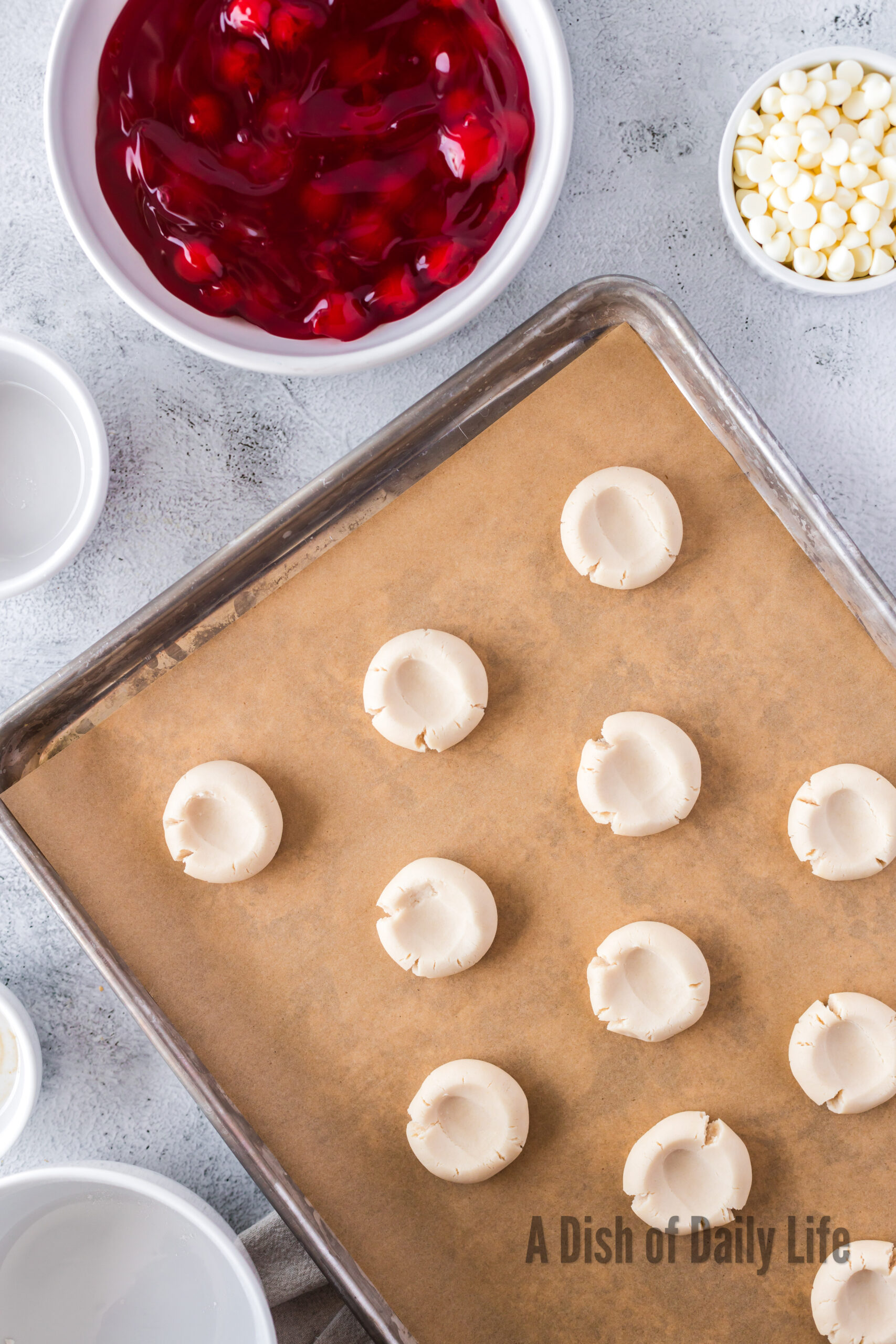 thumb print pressed into each ball of cookie dough