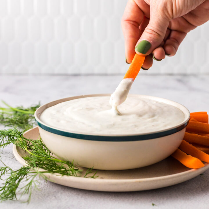 carrot being dipped into dip