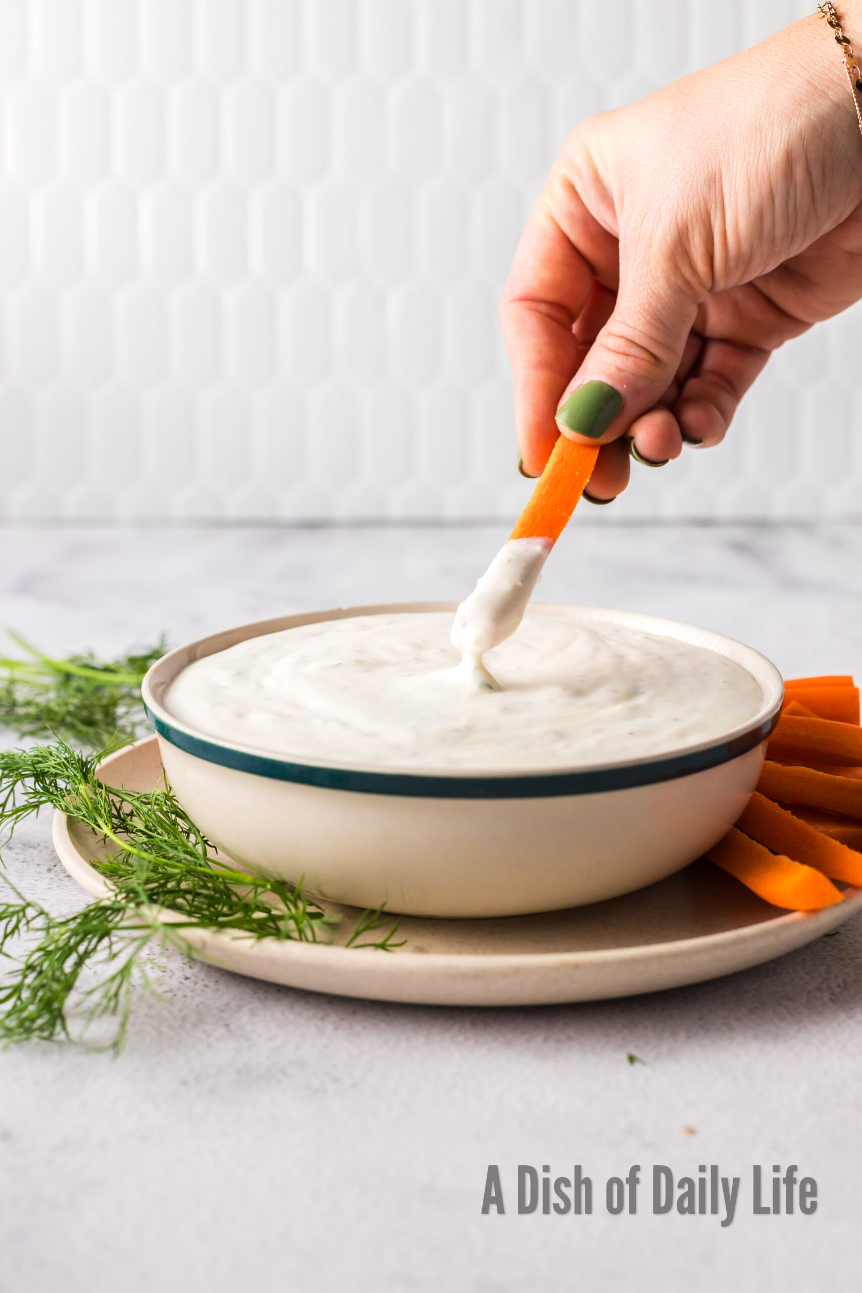 carrot being dipped into dip
