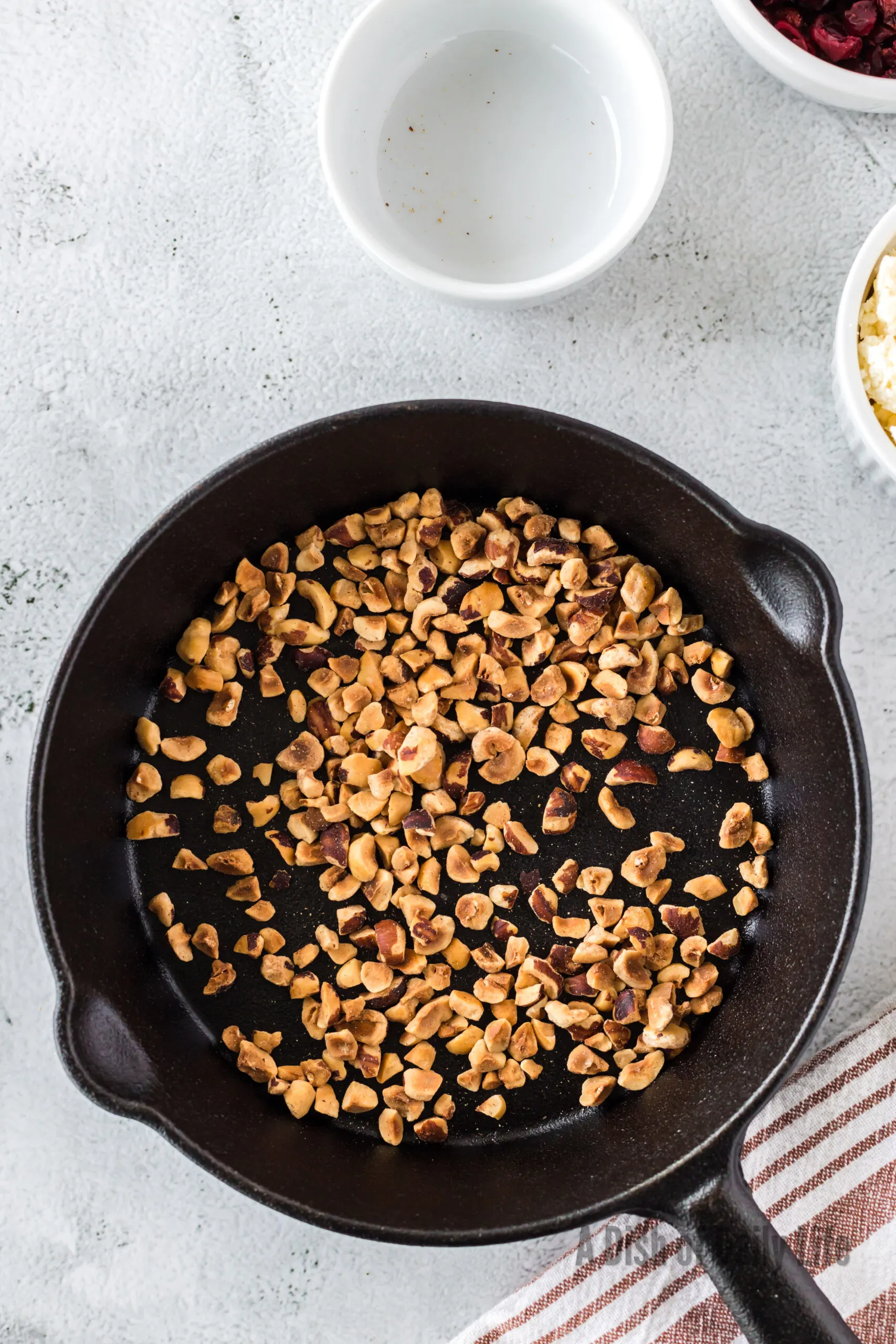 Hazelnuts toasting in a pan