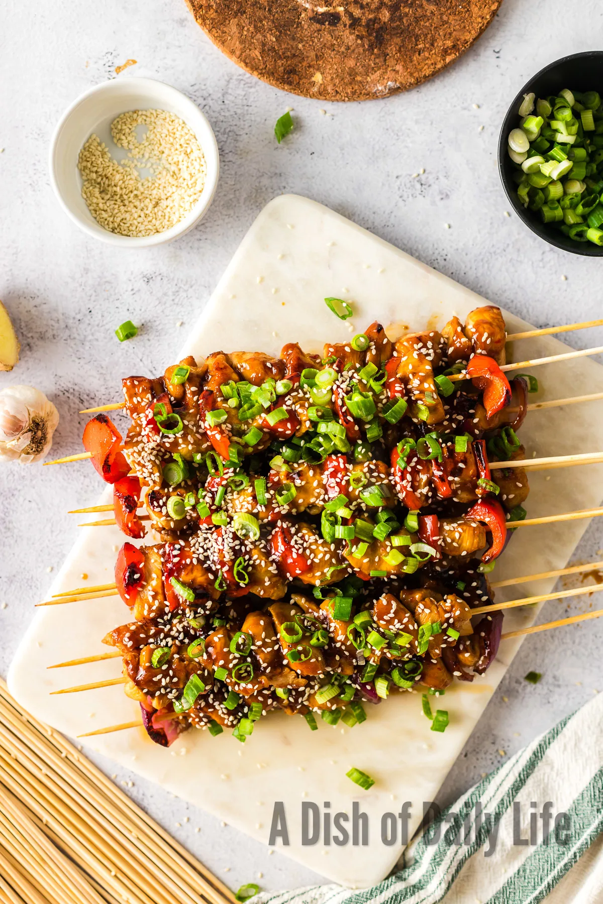 zoomed out image of chicken skewers cooked and ready to serve.