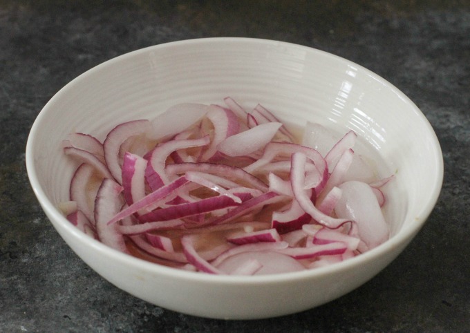 Soaking your onions in citrus juice and ice eliminates the onion aftertaste and keeps the onions crisp. 