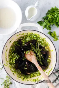 cold mussels added to pot with clam juice