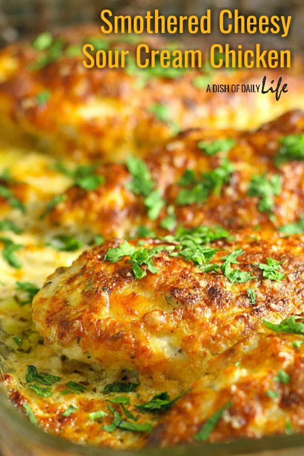 This family friendly Smothered Cheesy Sour Cream Chicken dish is quick, easy, and delicious! There's only ten minutes of prep time and then the oven takes care of the rest! #chicken #familydinners #easydinners #easydinnerrecipes