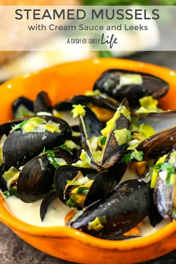 Easy to make, inexpensive, and delicious, these Steamed Mussels with Cream Sauce and Leeks are wonderful served with crusty bread. to mop all that delicious sauce up with! They work as both an appetizer and main dish..perfect for special occasions too! #Seafood | #Mussels | #PartyRecipes | #EasyRecipes | #FathersDay | #NewYears | #Christmas 