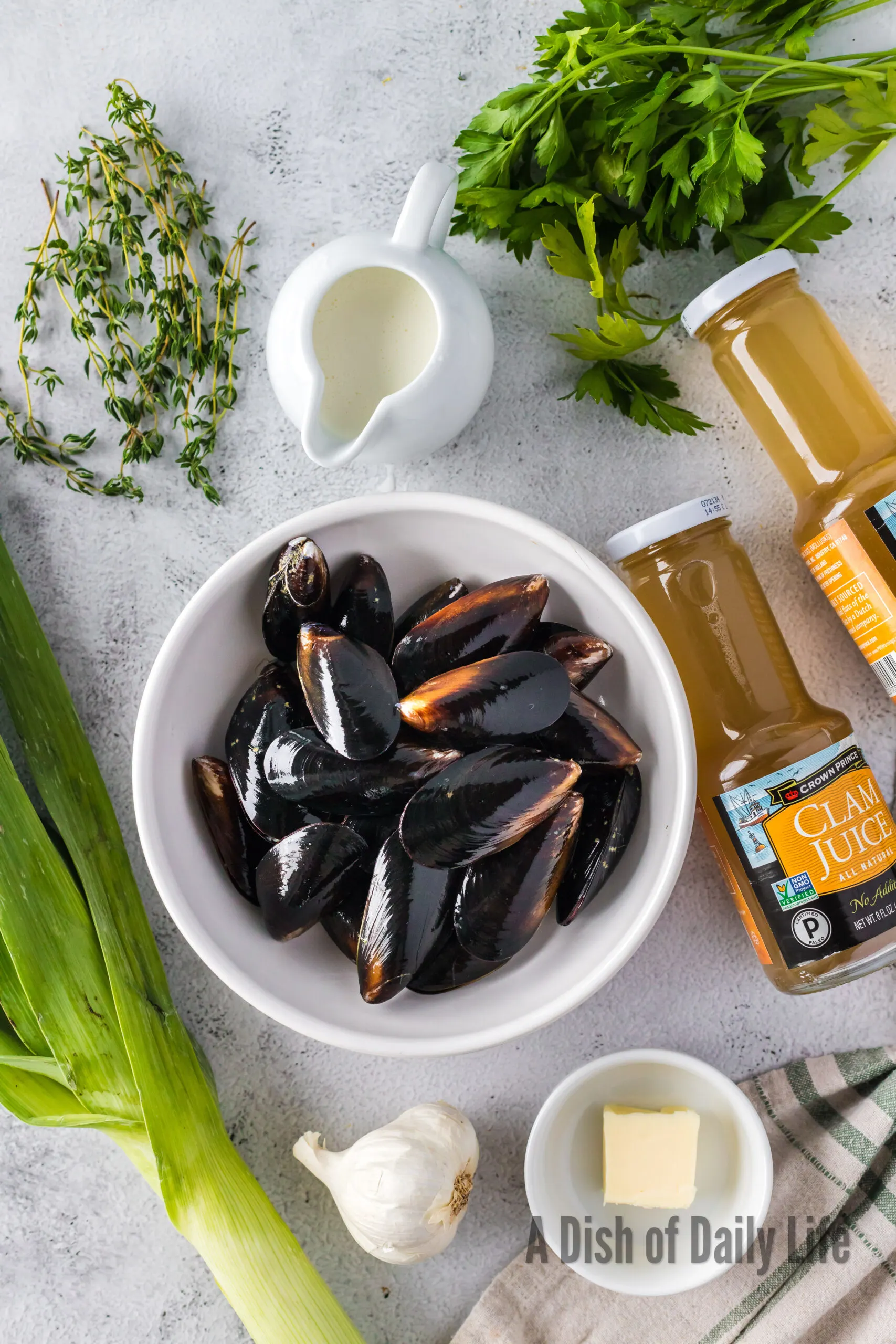 All ingredients for Mussels in Cream Sauce laid out on counter