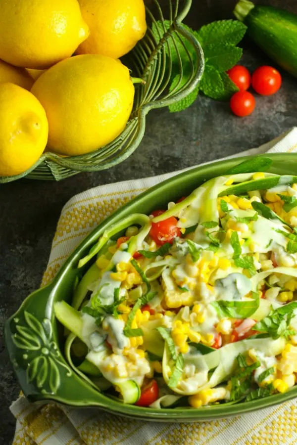 Zucchini Corn Salad with Lemon Yogurt Dressing...a simple, colorful salad packed with farm fresh flavors! The tanginess of the Greek yogurt and the lemon makes for a wonderful flavor combination with the zucchini, corn and tomato...a taste of summer in every bite! #Salad | #Zucchini | #Corn | #Healthy | #LemonYogurtDressing | #GreekYogurt