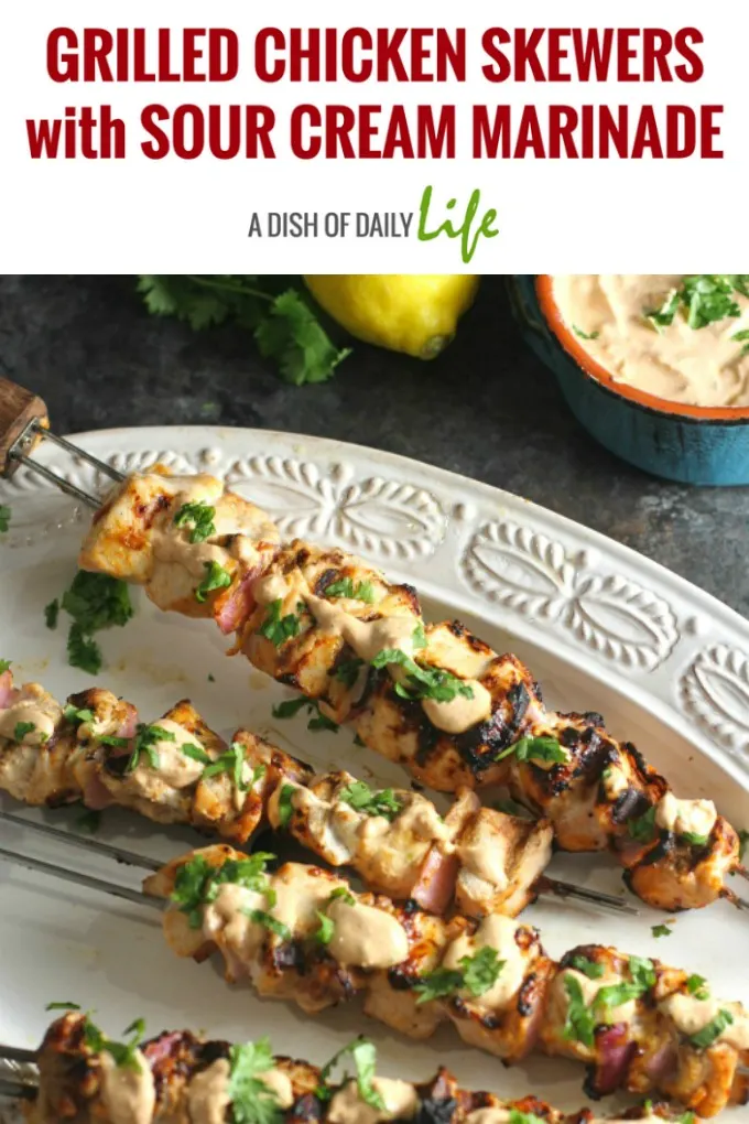 Grilled Chicken Skewers. Marinated in a sour cream sauce with Mediterranean spices, they are so tender and delicious…definitely a crowd pleaser! Don’t forget to save a little of the sauce for dipping after…SO good! #chicken #grilling #easydinner #skewers #kebabs
