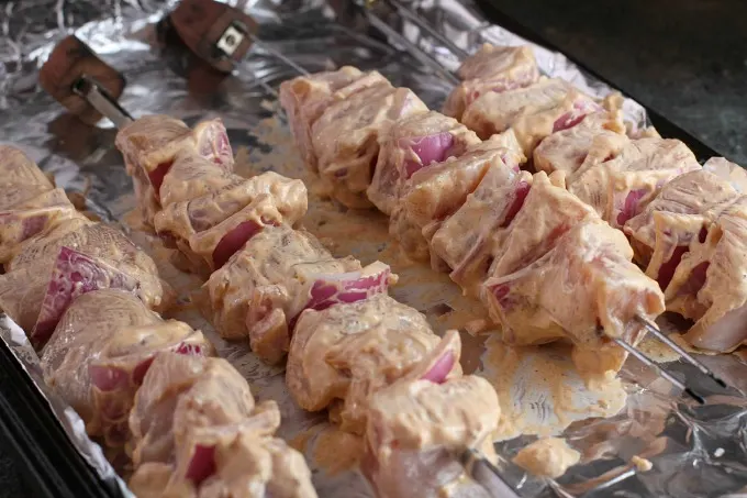 Chicken Skewers brushed with sour cream marinade, ready for the grill