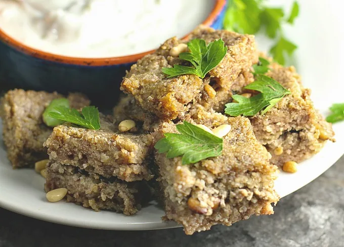 Baked Kibbeh with Yogurt Sauce...a Middle Eastern favorite! #Arabic #MiddleEastern #familyrecipes #lamb #appetizer #maindish #kibbe #kibbi