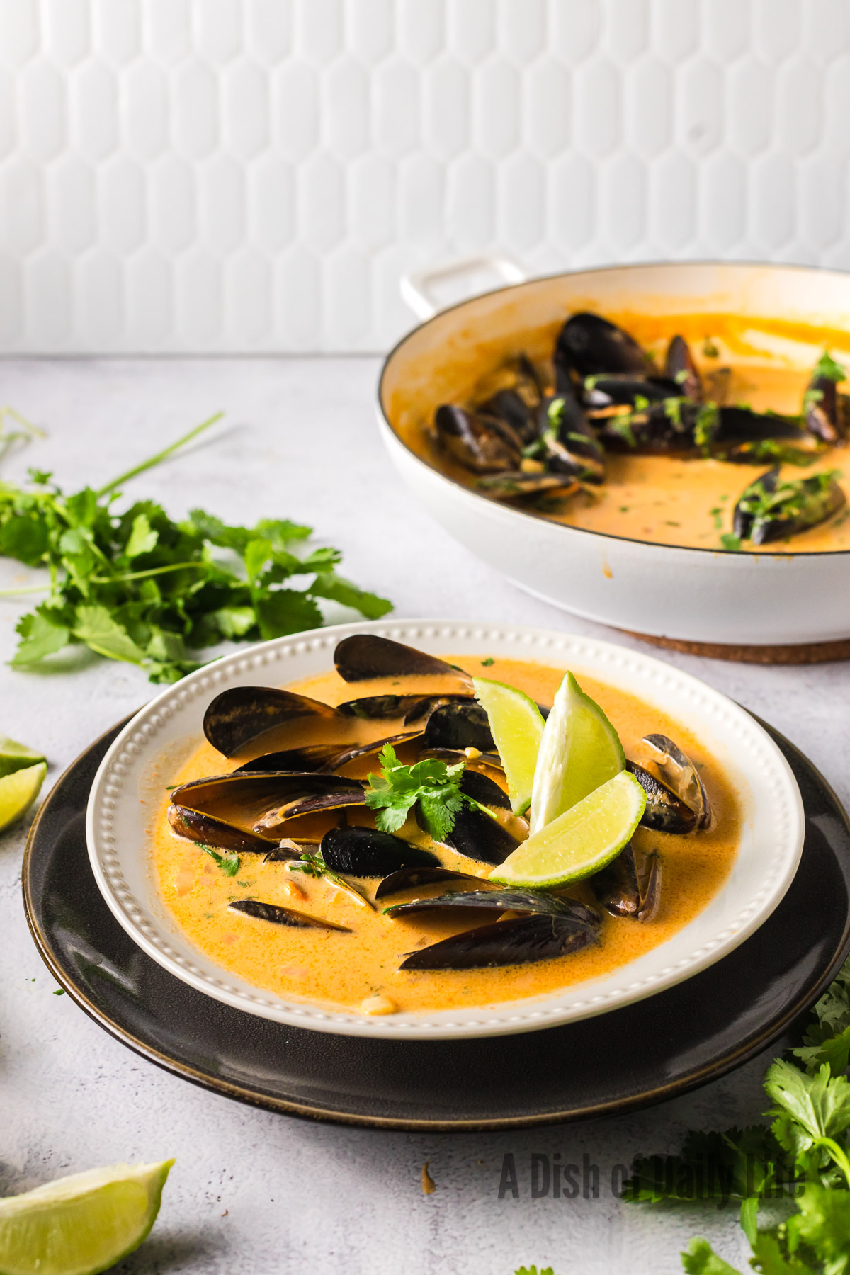 side view of clams in broth ready to enjoy.