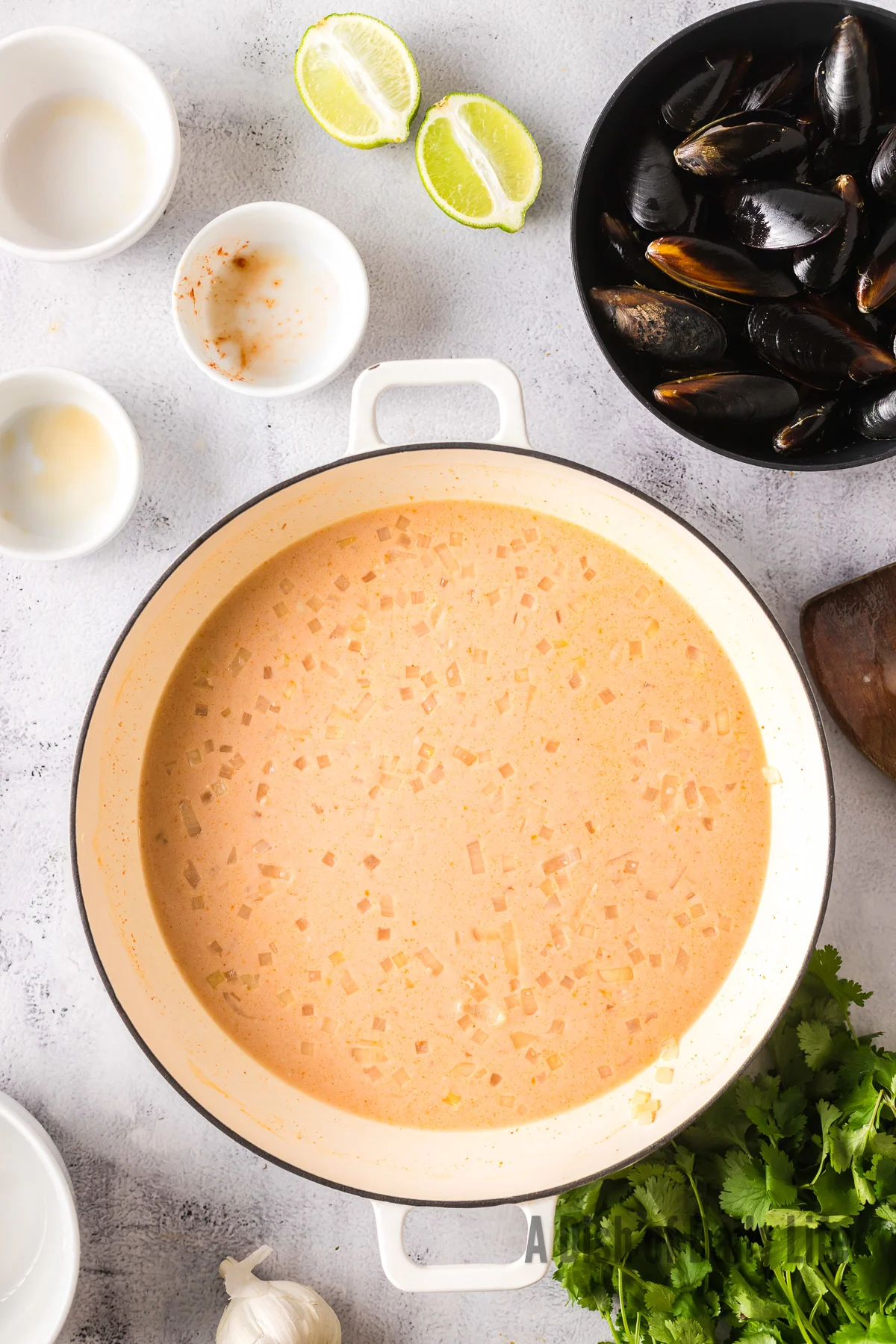 Red curry sauce mixed and ready for mussels