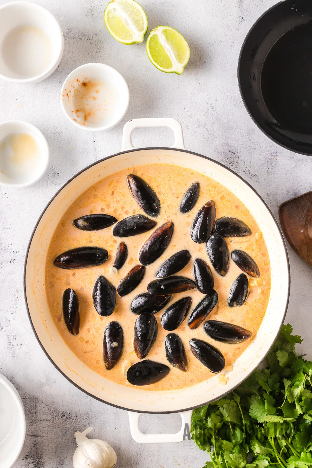 mussels added to red curry sauce