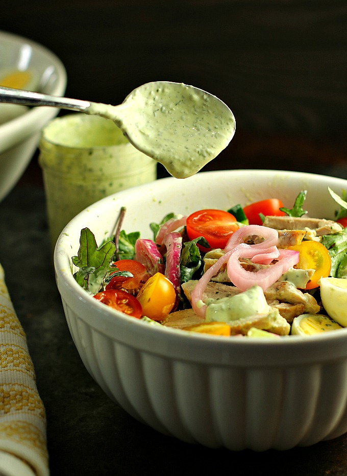 Swap out the sour cream for Greek yogurt in this "lightened" up version of Green Goddess Dressing! This delicious classic salad dressing doubles as a vegetable dip, and takes only minutes to make! #saladdressing #greengoddess #appetizer #vegetabledip 