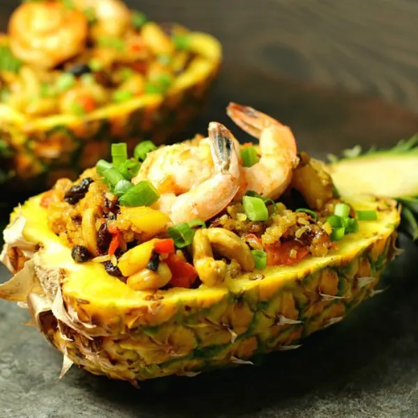 Pineapple Fried Rice is a fancy fried rice with pineapple, cashews, raisins, and a hint of curry. Skip the shrimp if you'd like and make it vegetarian. Serve it in a hollowed out pineapple to impress your guests!